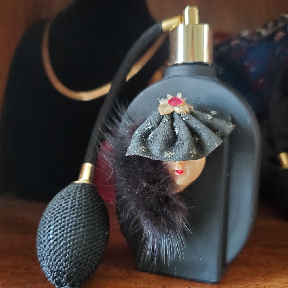 Perfume bottle empty of course Lady's face wearing a hat and mink Art deco